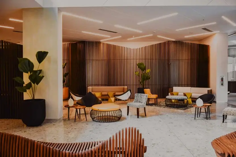 The welcoming reception area with soft lighting and natural wood textures.