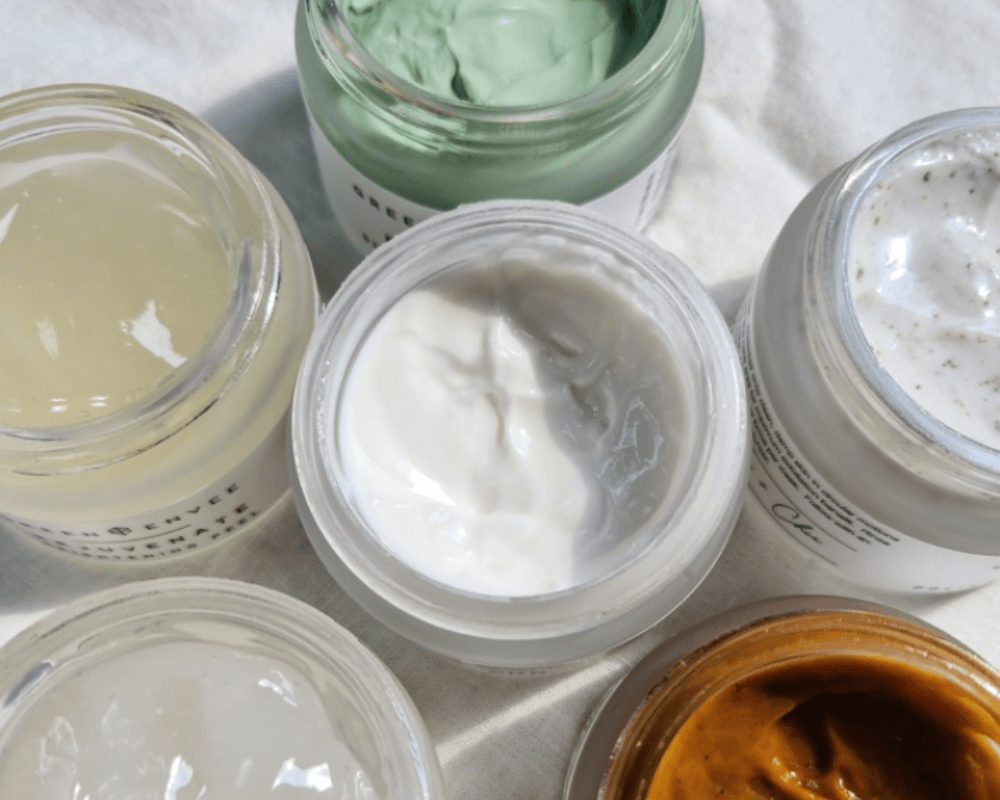 A collection of premium organic beauty products on a marble surface