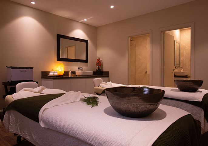 A serene room prepared for a detoxification body wrap